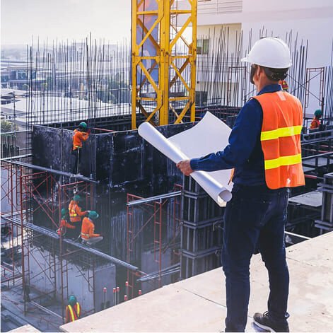 A Leinfra stationary concrete pump integrated into a large-scale high-rise building project, showcasing its vertical pumping capabilities.